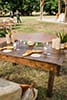 Boho wedding sweetheart farm table with antique couch