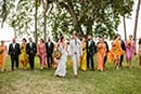 Boho, mismatch bridesmaids, groomsmen in green suits, light beige groom suit, boho fringe bride - boho bridal party