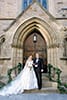 Bride and Groom on Steps of Church | New England Wedding Photographers